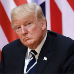 Trump in front of UK and US flags